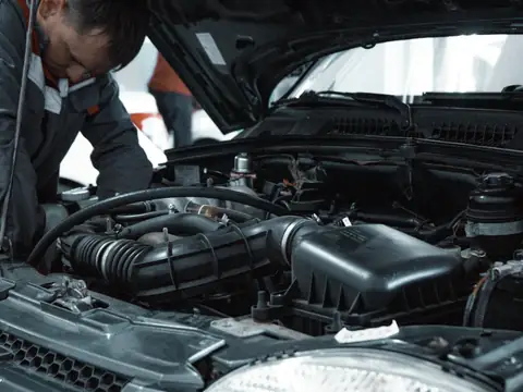 A mechanic inspecting an engine