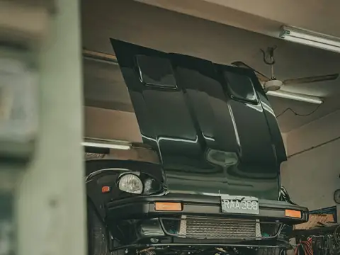 A car raised on a lift for inspection